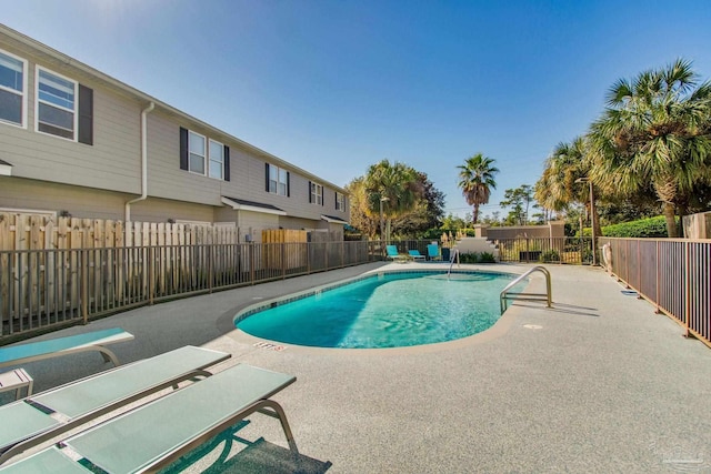 view of swimming pool with a patio area