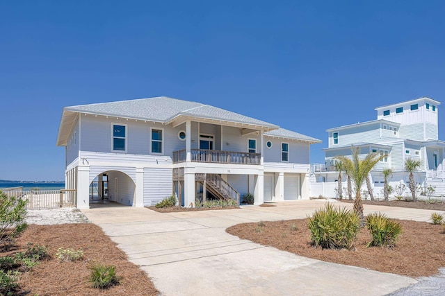 view of front of house with a garage and a carport