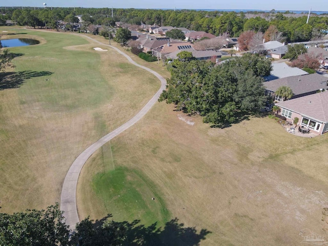birds eye view of property featuring a residential view, a water view, and view of golf course