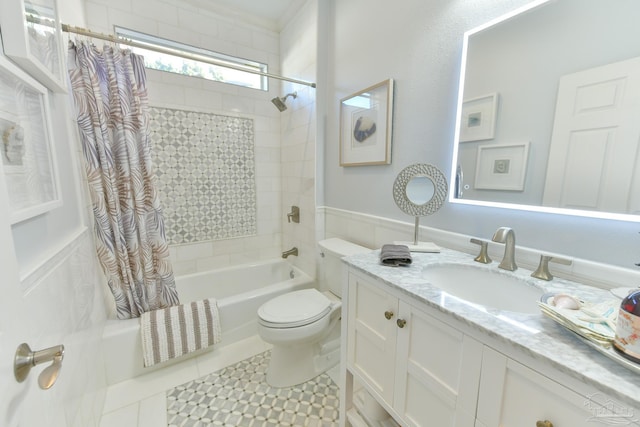 full bathroom featuring shower / tub combo with curtain, tile patterned flooring, vanity, and toilet