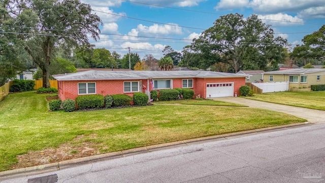 ranch-style home with a front yard and a garage