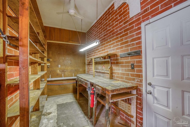 interior space with ceiling fan