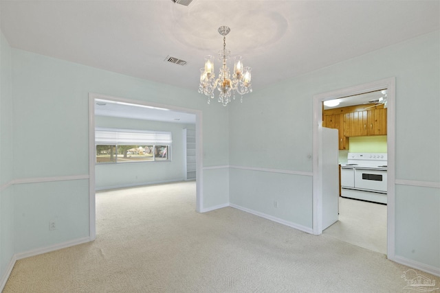 unfurnished dining area with light carpet and a notable chandelier