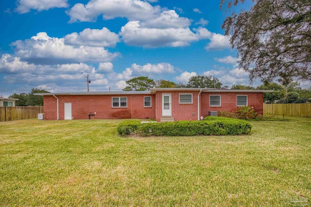 back of house with a yard