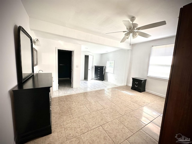 unfurnished living room with ceiling fan