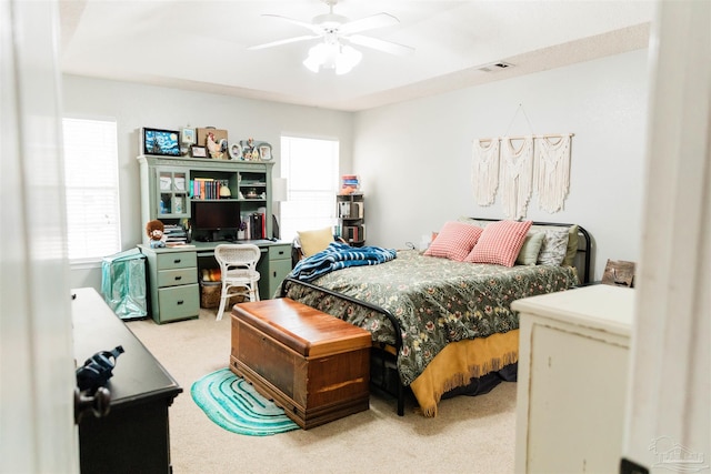 carpeted bedroom featuring ceiling fan