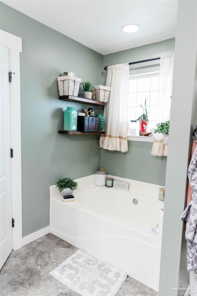 bathroom featuring a tub to relax in