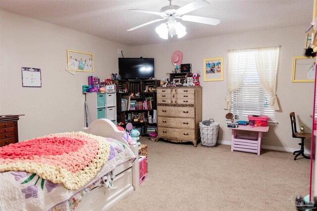 bedroom with ceiling fan and light carpet