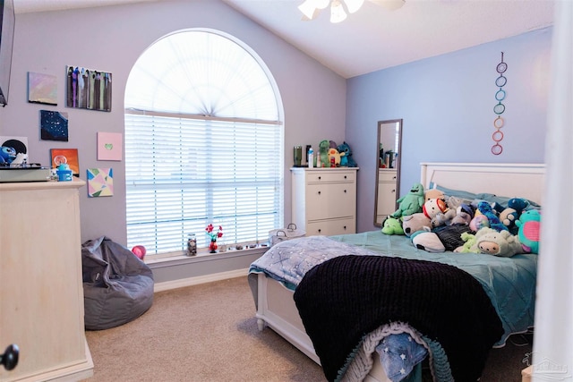 carpeted bedroom featuring vaulted ceiling and ceiling fan