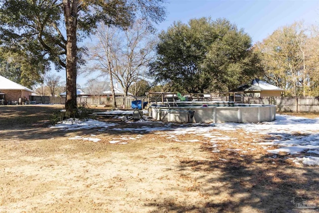 view of yard with a fenced in pool