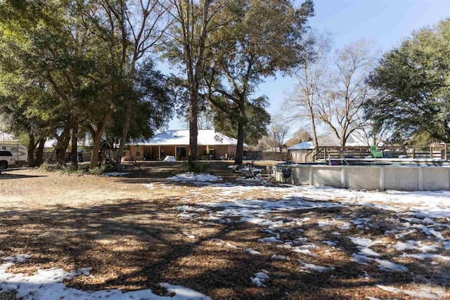 view of yard covered in snow