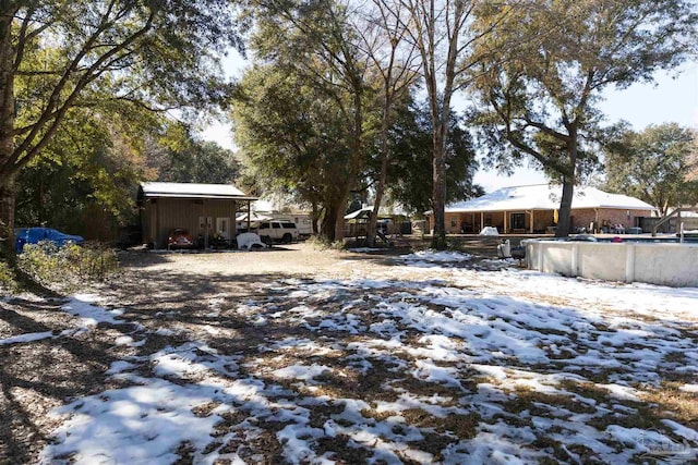 view of yard layered in snow