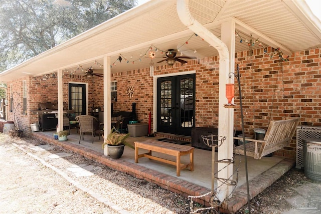 property entrance featuring a patio, ceiling fan, and french doors