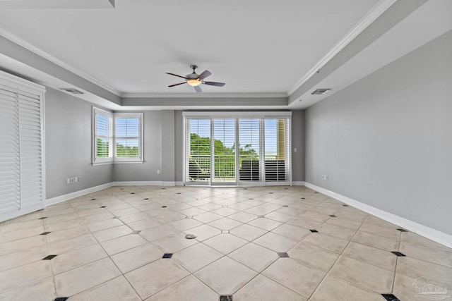 1700 Scenic Hwy Unit 404, Pensacola, FL 32503 - spare room featuring a tray ceiling, ceiling fan, baseboards, crown molding, and light tile patterned floors