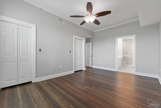1700 Scenic Hwy Unit 404, Pensacola, FL 32503 - unfurnished bedroom featuring multiple closets, crown molding, wood finished floors, baseboards, and ensuite bathroom