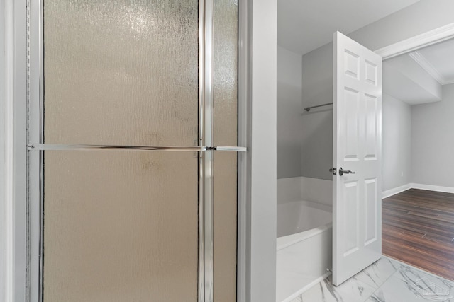 1700 Scenic Hwy Unit 404, Pensacola, FL 32503 - bathroom featuring a bath, a stall shower, baseboards, crown molding, and marble finish floors
