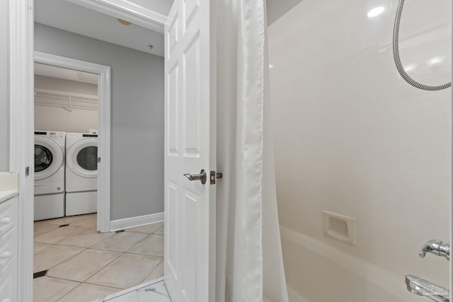 1700 Scenic Hwy Unit 404, Pensacola, FL 32503 - bathroom featuring separate washer and dryer, shower / tub combo with curtain, and vanity