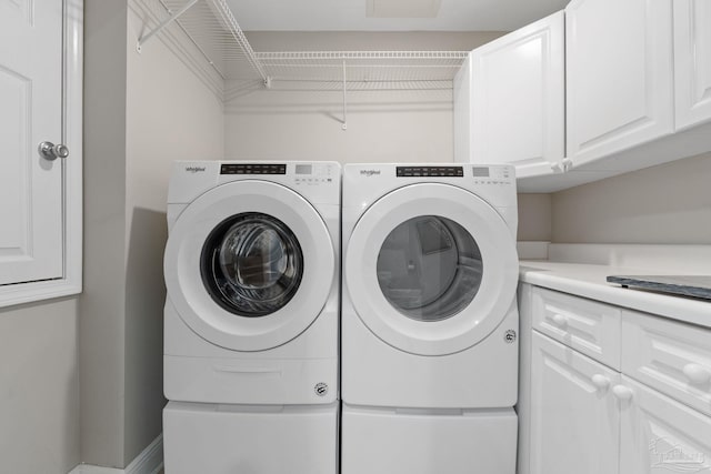 1700 Scenic Hwy Unit 404, Pensacola, FL 32503 - laundry area featuring cabinet space and washer and dryer