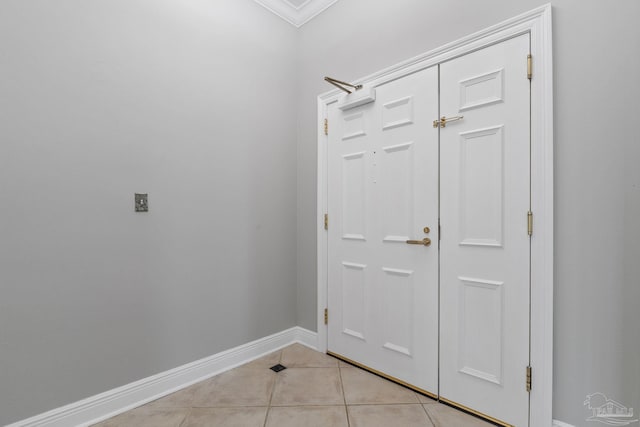1700 Scenic Hwy Unit 404, Pensacola, FL 32503 - entryway featuring baseboards, light tile patterned floors, and ornamental molding