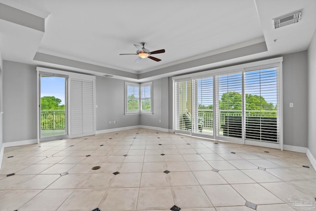 1700 Scenic Hwy Unit 404, Pensacola, FL 32503 - spare room with a raised ceiling, baseboards, ceiling fan, and light tile patterned flooring
