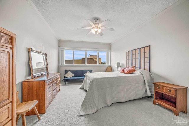 bedroom featuring light carpet, a textured ceiling, and crown molding