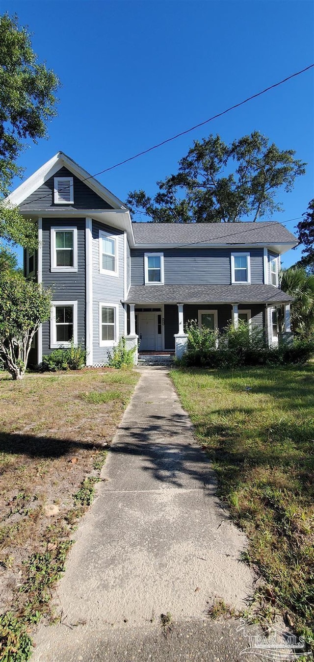 view of front of property with a front lawn