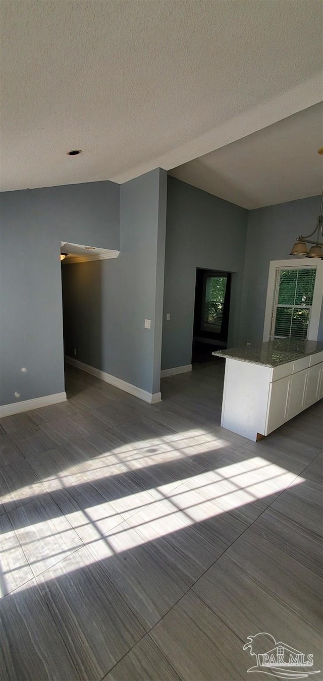 unfurnished living room featuring a textured ceiling