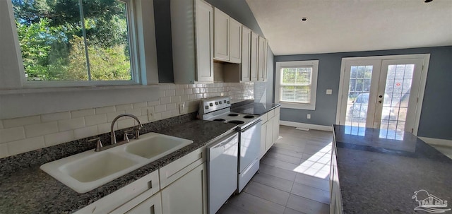 kitchen with sink, white cabinetry, french doors, white appliances, and decorative backsplash