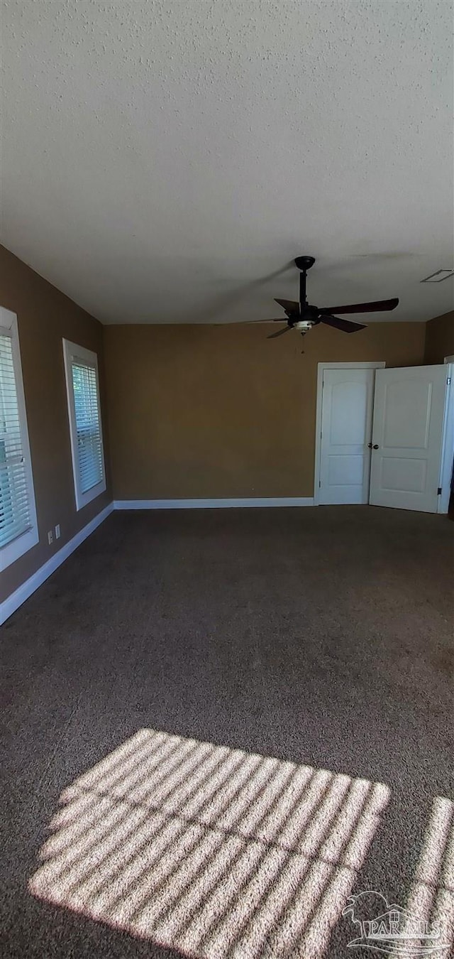 unfurnished living room with a textured ceiling