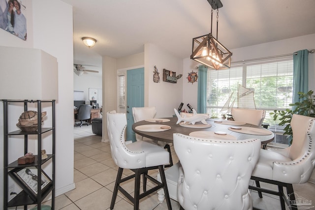 dining room with light tile patterned flooring and a ceiling fan