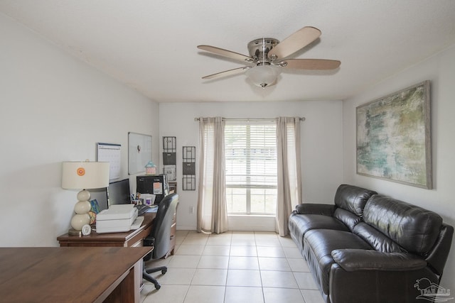 office area with a ceiling fan and light tile patterned floors