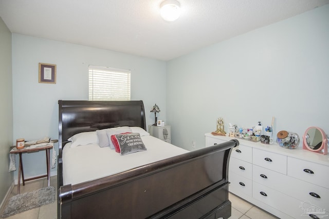 bedroom featuring light tile patterned floors