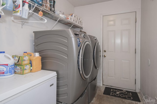 laundry room with laundry area and washing machine and dryer