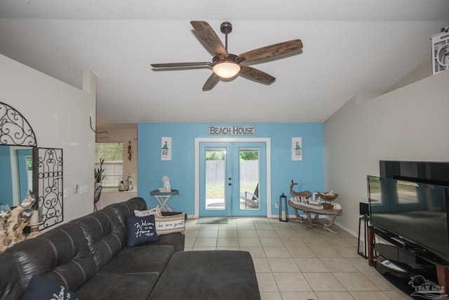 living room with light tile patterned floors, ceiling fan, plenty of natural light, and french doors