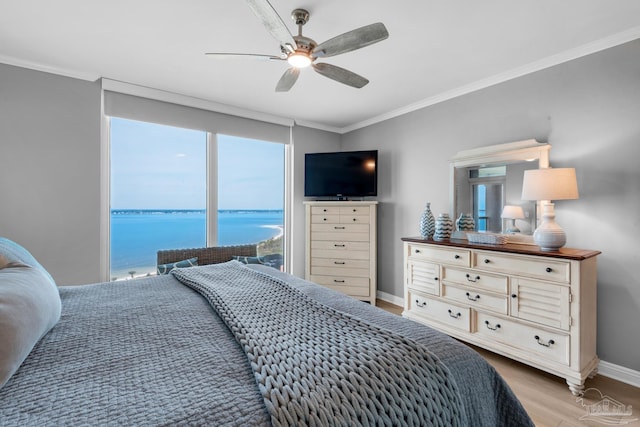 bedroom with crown molding, ceiling fan, and light hardwood / wood-style flooring