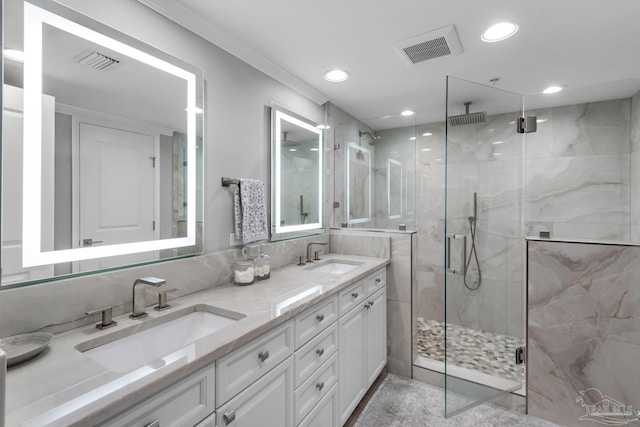 bathroom with vanity and a shower with shower door