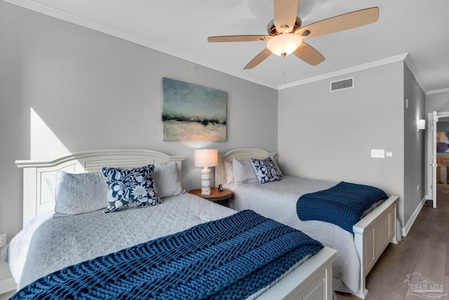 bedroom featuring crown molding, ceiling fan, and wood-type flooring