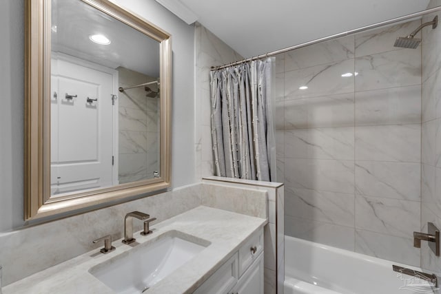 bathroom featuring shower / tub combo with curtain, vanity, and decorative backsplash