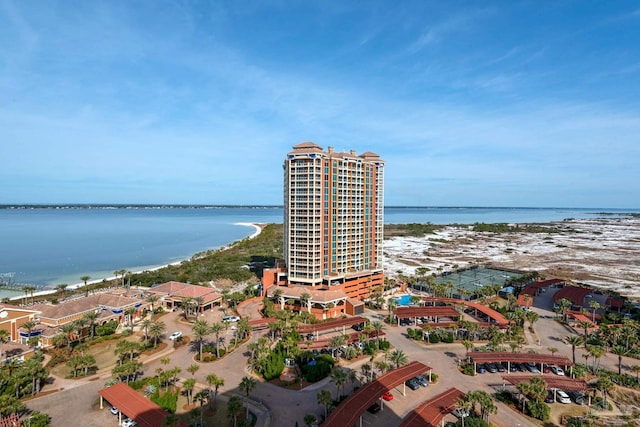 birds eye view of property with a view of the beach and a water view