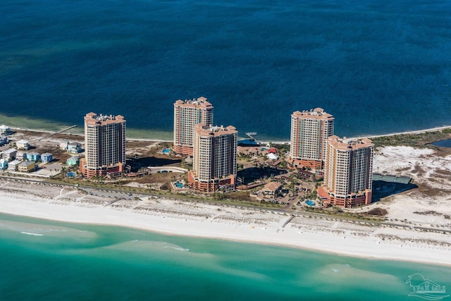 birds eye view of property featuring a view of the beach and a water view