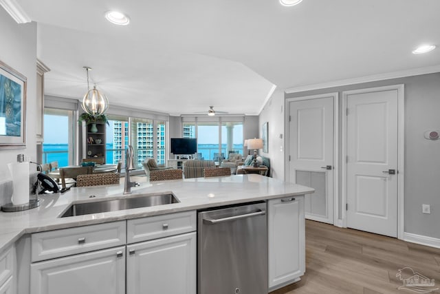 kitchen featuring sink, ornamental molding, dishwasher, light stone countertops, and white cabinets