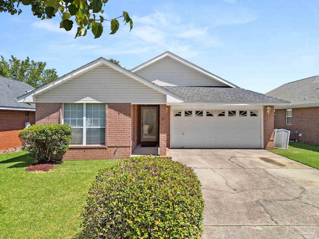 28 Easton St, Cantonment, FL 32533 - single story home featuring brick siding, a garage, driveway, a front lawn, and a shingled roof