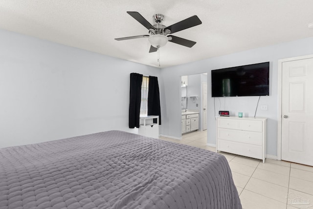 28 Easton St, Cantonment, FL 32533 - bedroom with light tile patterned flooring, ceiling fan, connected bathroom, and baseboards