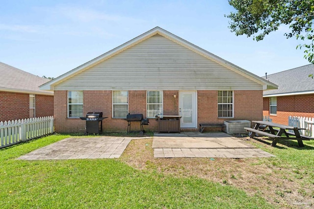 28 Easton St, Cantonment, FL 32533 - back of house featuring a patio area and brick siding