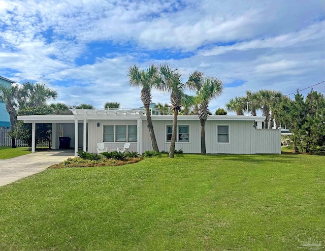1207 Ariola Dr, Pensacola Beach, FL 32561 - view of front facade with driveway, a front yard, and a carport