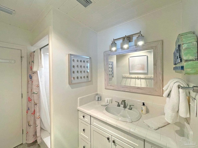 1207 Ariola Dr, Pensacola Beach, FL 32561 - full bathroom with a shower stall, vanity, and ornamental molding