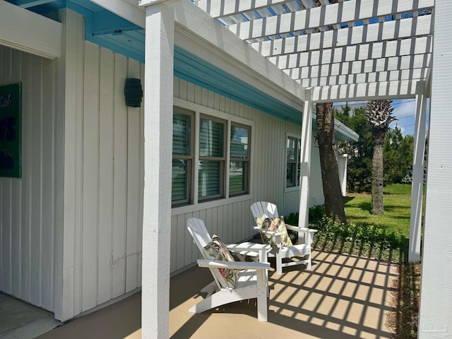 1207 Ariola Dr, Pensacola Beach, FL 32561 - view of patio featuring a pergola