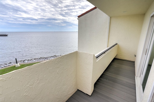 balcony featuring a water view