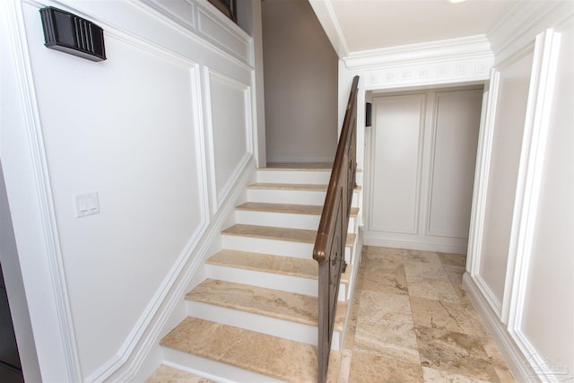 stairs featuring ornamental molding