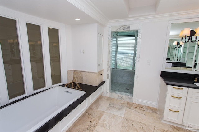 bathroom with vanity, a notable chandelier, ornamental molding, and plus walk in shower